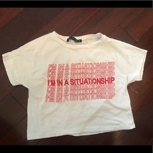 In a situationship white tee.